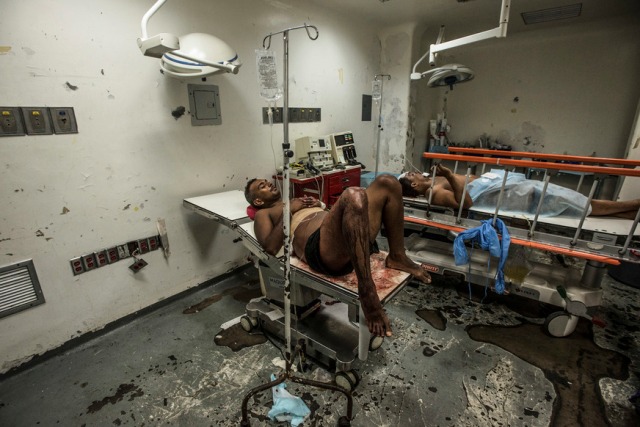 Jose Villarroel waits for hours in an emergency operating room at Luis Razetti Hospital in Puerto la Cruz, Venezuela, April 15, 2016. The economic crisis in this country has exploded into a public health emergency, part of a larger unraveling that has become so widespread it has prompted President Nicolas Maduro to impose a state of emergency, raising fears of a government collapse. (Meridith Kohut/The New York Times)